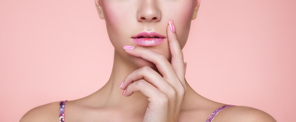 Wall Mural - Beauty Woman with perfect Makeup and Manicure. Pink Lips and Nails. Beauty girls Face isolated on light Background. Fashion photo