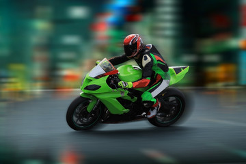 Wall Mural - Motorcycle rider racing on the nighttime background