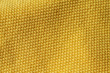 Closeup macro di una maglia di cotone gialla, texture giallo