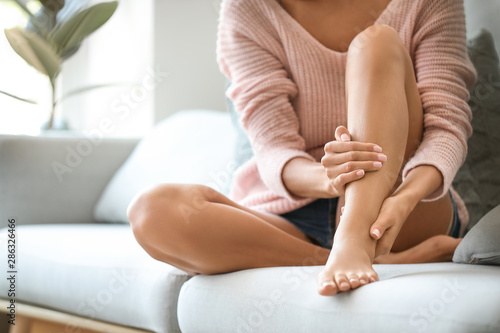 Young woman with beautiful legs at home Tableau sur Toile