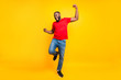 © deagreez - Full length body size photo of rejoicing glad cheerful happy black man dancing with joy while isolated with yellow background
