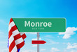 © MQ-Illustrations - Monroe – New York. Road or Town Sign. Flag of the united states. Blue Sky. Red arrow shows the direction in the city. 3d rendering