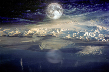 snow covered mountains against blue sky with clouds and moon in winter at night. arctic landscape wi