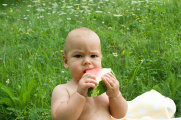 baby eats watermelon, baby outdoors, first lure