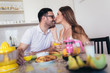 © Mediteraneo - Happy couple enjoying breakfast time together at home.