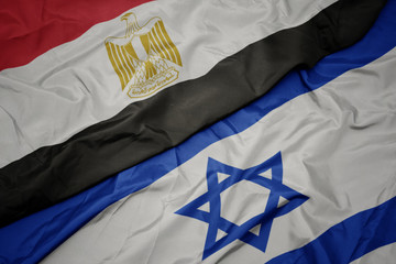 Wall Mural - waving colorful flag of israel and national flag of egypt .