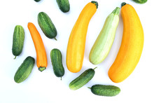 Fresh Harvested Yellow Zucchini Squash And Green Cucumbers