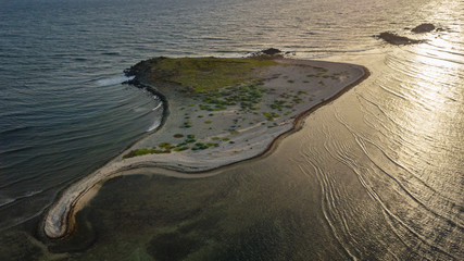 Poster - Drone view of Caye Chateau at sunset in Saint Martin