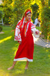© Bas - portrait of young woman in autumn park in national Ukrainian wear red Embroidered shirt