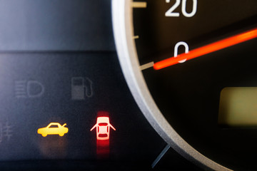 Wall Mural - glowing light bulbs of open doors on a car dashboard