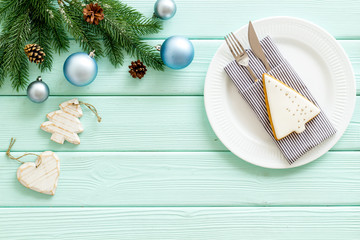 2020 year celebration with table setting, ginger cookies on mint green wooden background top view mock up