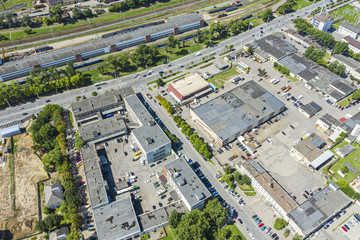 Wall Mural - aerial top view of roofs of industrial buildings. manufacturing companies and factories at urban industrial area