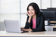 © Bangkok Click Studio - Asian businesswoman using notebook computer..