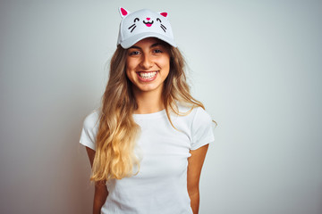 Canvas Print - Young beautiful woman wearing cat cap over grey isolated background with a happy face standing and smiling with a confident smile showing teeth