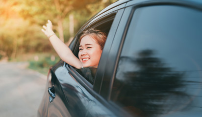 Wall Mural - Hatchback Car travel driving road trip of asian woman summer vacation in blue car at sunset,Girls happy traveling enjoy holidays and relaxation with friends together get the atmosphere