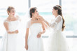 © Bangkok Click Studio - Group of beautiful brides arrange their dress..