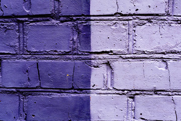 Texture of a brick wall with cracks and scratches which can be used as a background