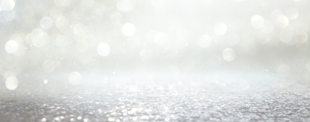 background of abstract glitter lights. silver and gold. de-focused. banner