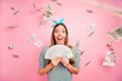 © deagreez - Portrait of her she nice attractive lovely charming cute cheerful cheery glad delighted straight-haired girl holding in hands cashback isolated over pink pastel background