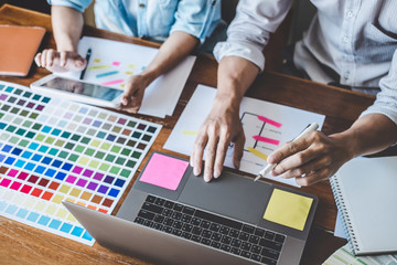 Wall Mural - team of creative web/graphic designer planning, drawing website ux app for mobile phone application 