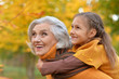 © aletia2011 - Grandmother with her granddaughter in the autumn park