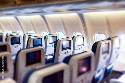 Fotografía Modern aircraft interior with seats and blank touch entertainment screens displays