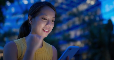 Poster - Woman use of mobile phone in city at night