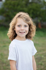 Wall Mural - Funny blond kid with long hair