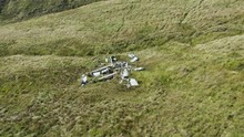 Aerial Drone View Orbiting The Wreckage Of An Old, Crashed Jet Fighter On A Welsh Hillside (Vampire)
