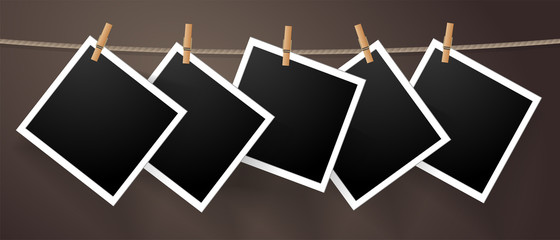 Fototapete - Realistic detailed photo icon design template. Photo frames hanging on the rope with clothespines