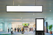 © thanongsak - two blank advertising billboard at airport background large LCD advertisement