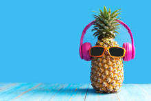 Summer In The Party.  Hipster Pineapple Fashion In Sunglass And Music Bright Beautiful Color In Holiday, Creative Art Fruit For Tropical Style On The Beach Vibes, Blue Background.  Fashion Summer 