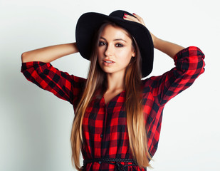 young pretty brunette girl hipster in hat on white background casual close up dreaming smiling