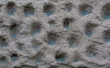 Wall pattern. City background. The texture of the building. Uneven surface