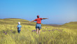 © avtk - Mom and son running in field