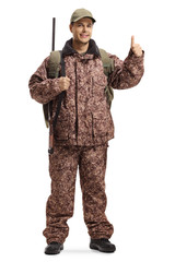 Wall Mural - Hunter in a uniform showing thumbs up