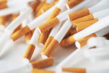 Close Up Of A Smoking Cigarettes . Cigarette Filter Tubes