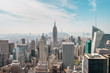 New York City Manhattan, NYC/ USA - 08 21 2017: Top of the Rock panorama view over skyline from Rockefeller center to NYC and the Empire State building on a light cloudy sunny day with blue sky