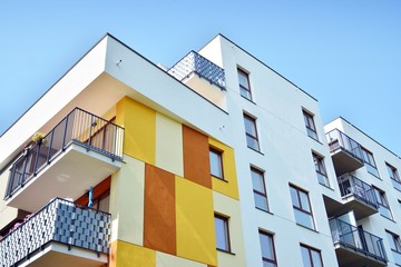 Modern apartment buildings on a sunny day with a blue sky. Facade of a modern apartment building