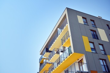 Modern apartment buildings on a sunny day with a blue sky. Facade of a modern apartment building