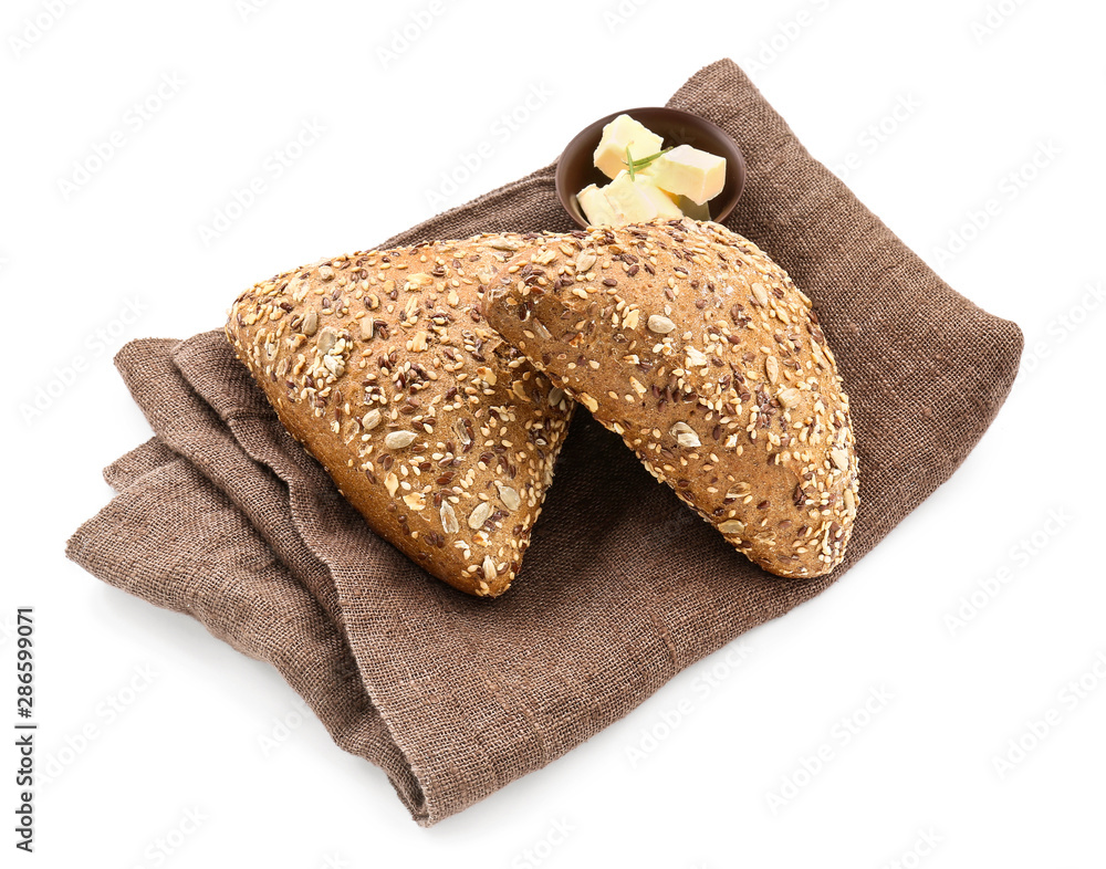 Tasty buns with butter on white background