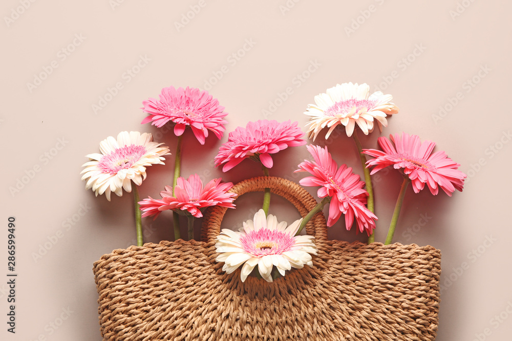 Eco bag with fresh flowers on grey background