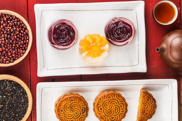 Poster - Traditional mooncakes on table setting with teacup.