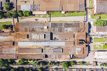 Wall Mural - city industrial zone, aerial view landscape. old factories and plants with rusty roofs