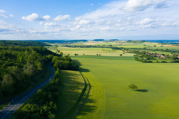 Wall Mural - La campagne française, une route et un village.