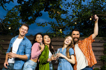 Cheerful young people celebrating friendship