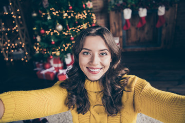 Poster - Self portrait of cheerful rejoicing girl shooting herself in eve of new year while wearing yellow knitted jumper