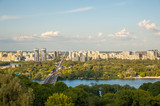Fototapeta Miasto - View of the city of Kiev, the Dnieper River. City panorama with a place across the river, park, summer day.