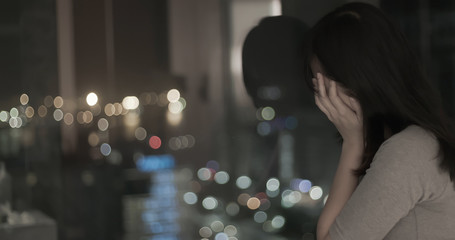 Wall Mural - woman feel depressed by window