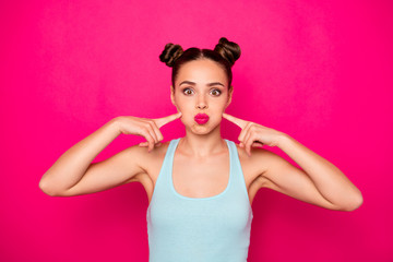 Sticker - Close up photo of careless lady pointing her fingers on her face isolated over fuchsia background